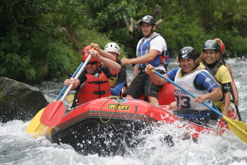 People in Raft on River