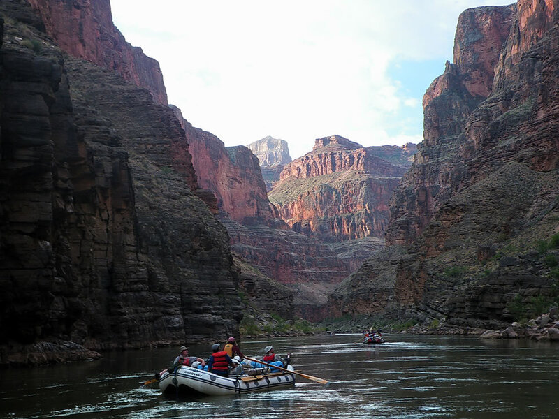 People in Rafts on River