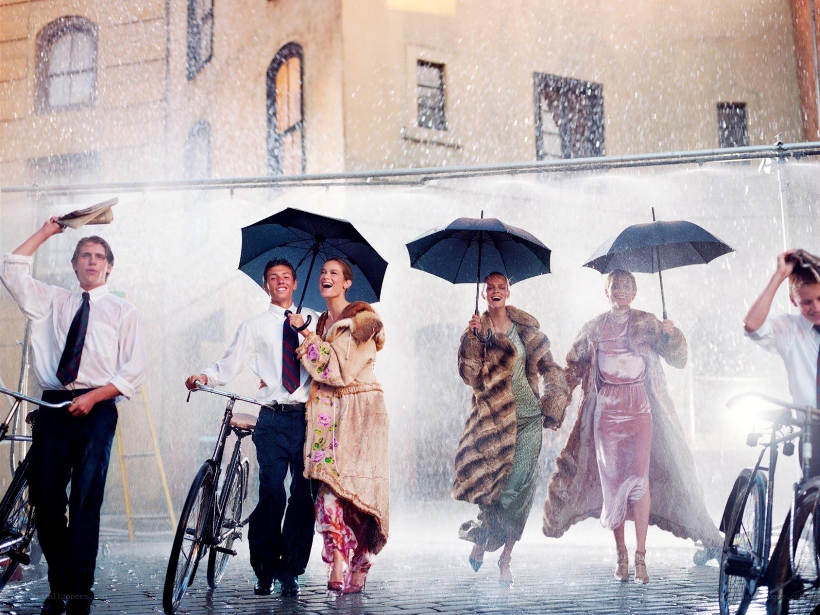 People in rain with umbrellas
