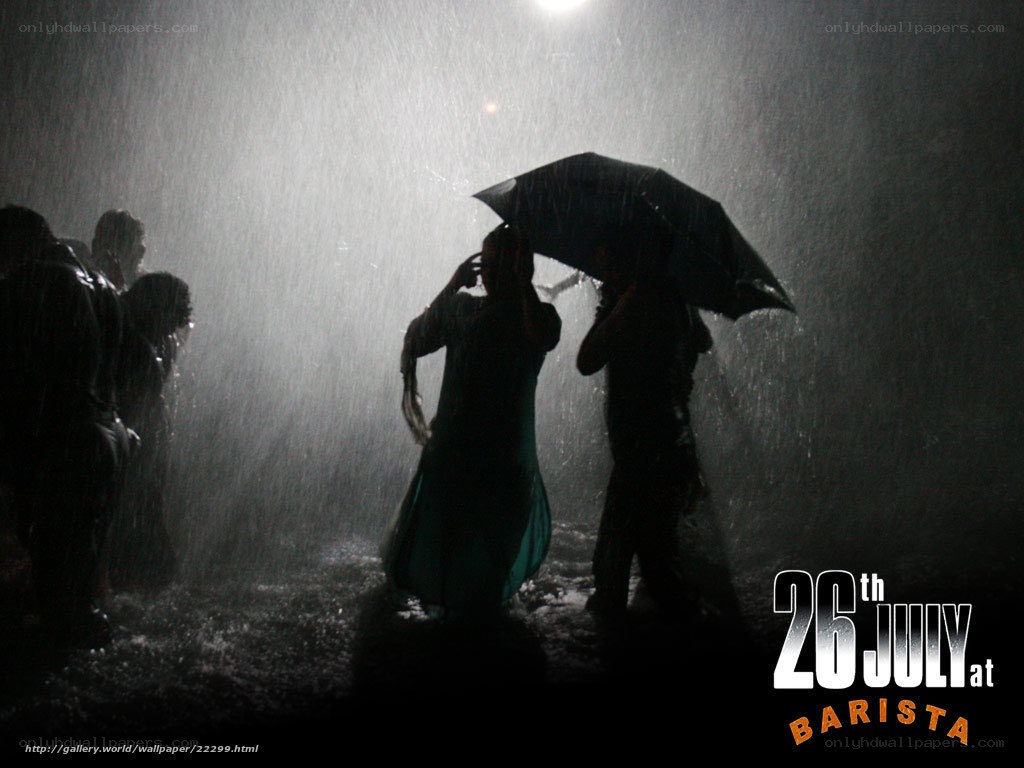 People in the rain at night