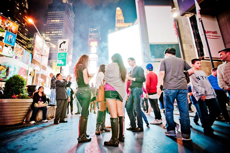 People in Times Square at night
