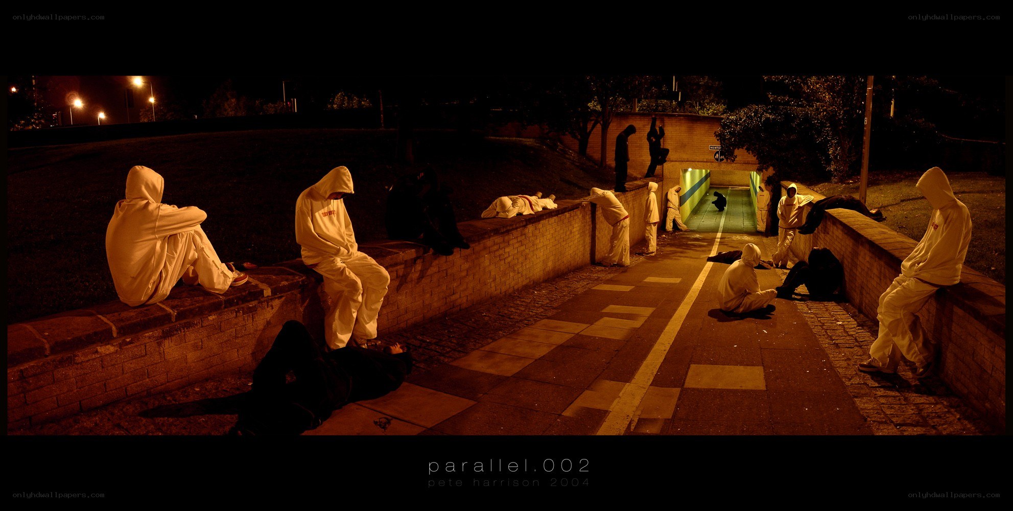 People in white suits at night