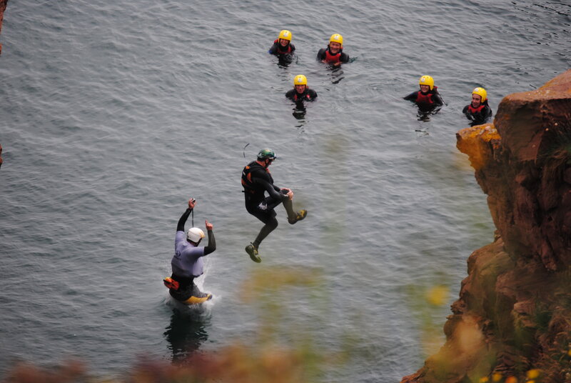 People Jumping into Water