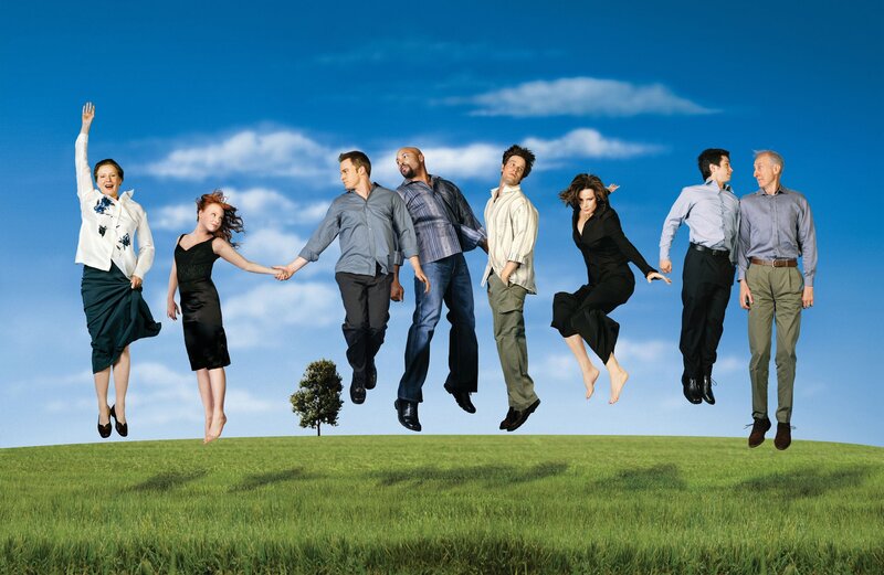 people jumping on a hill
