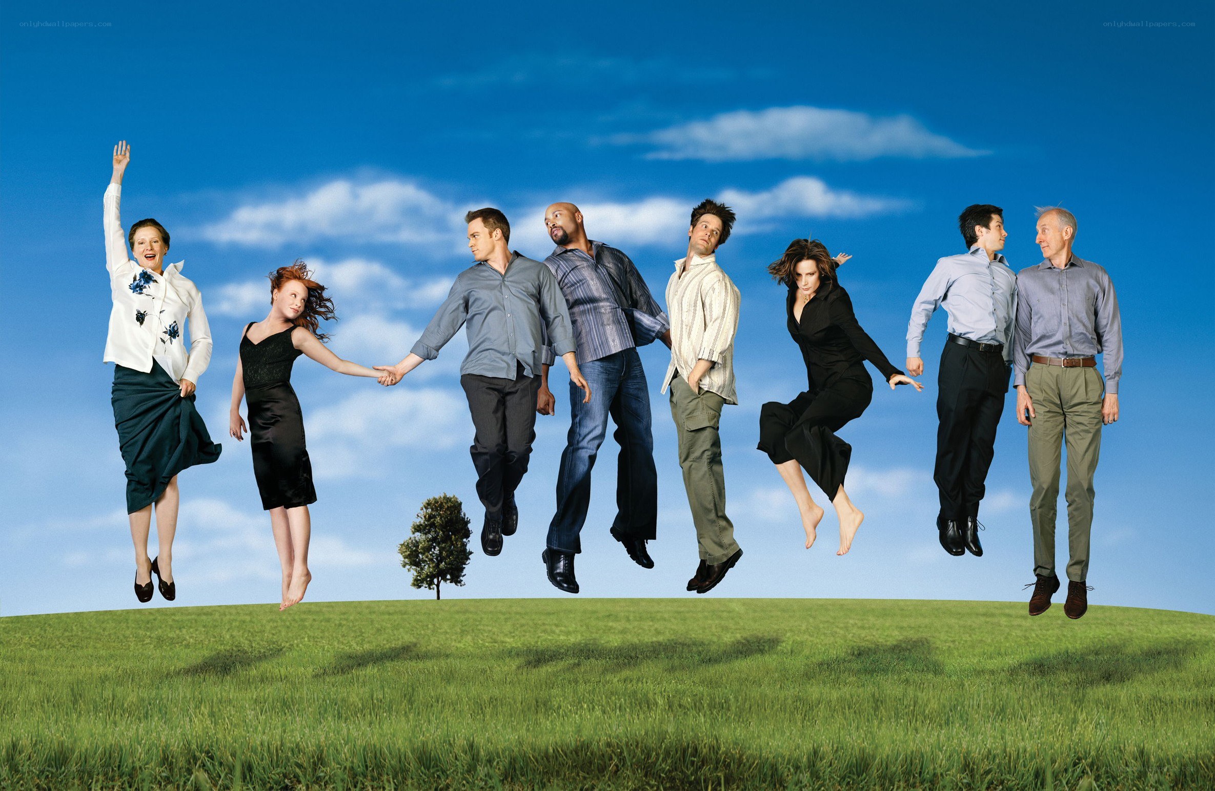 people jumping on a hill
