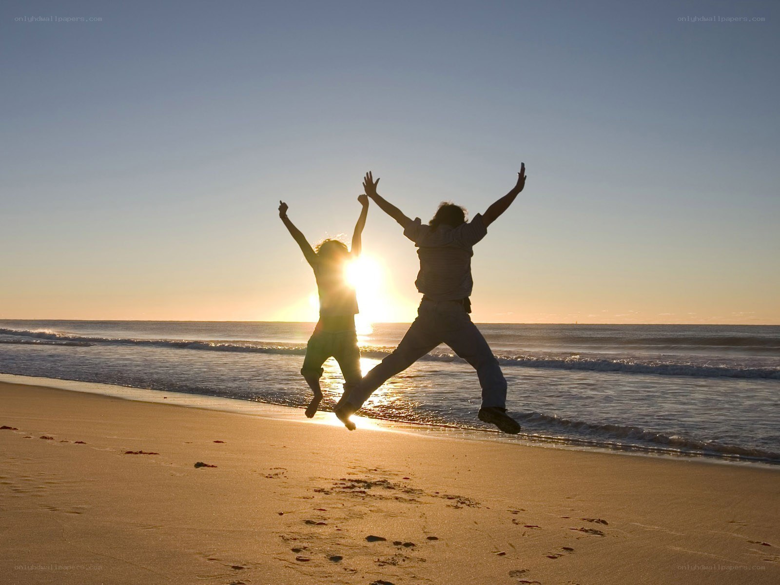 People jumping on the beach