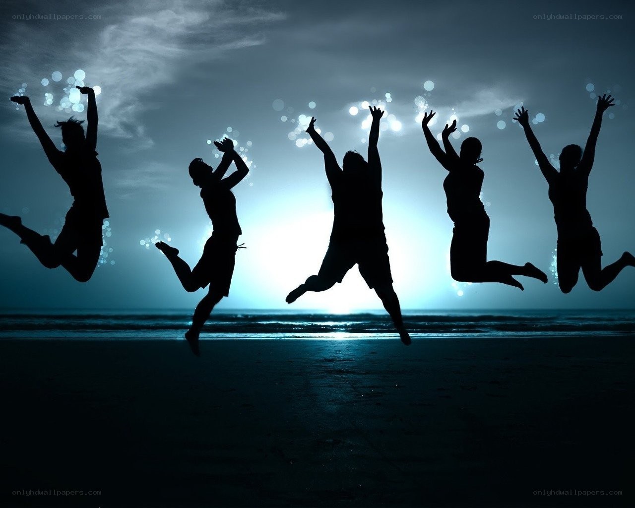 People jumping on the beach