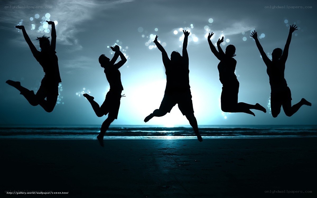People jumping on the beach