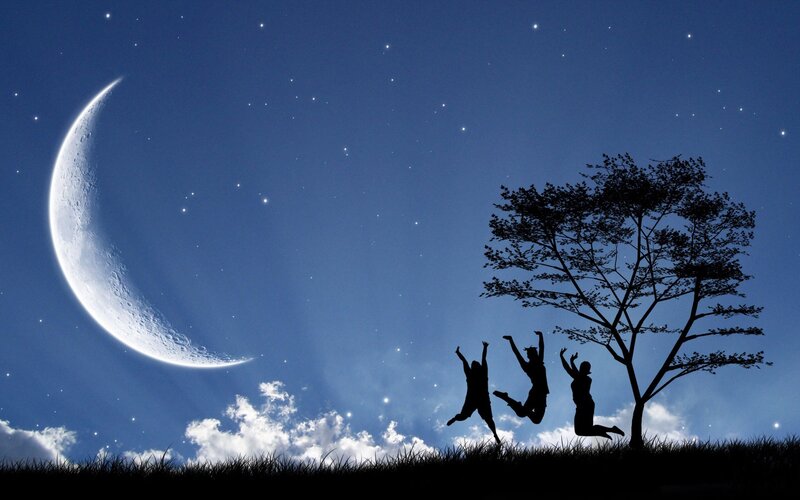 People jumping under moonlight