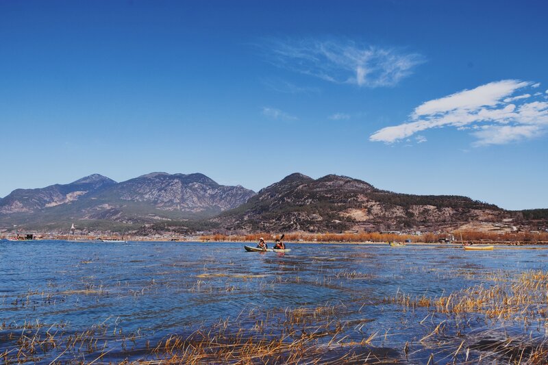 People Kayaking in Lake