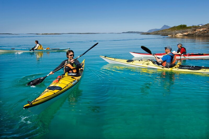 People Kayaking in Sea