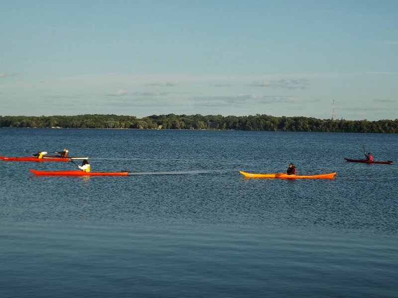 People Kayaking on Lake
