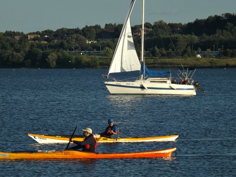 People Kayaking on Water