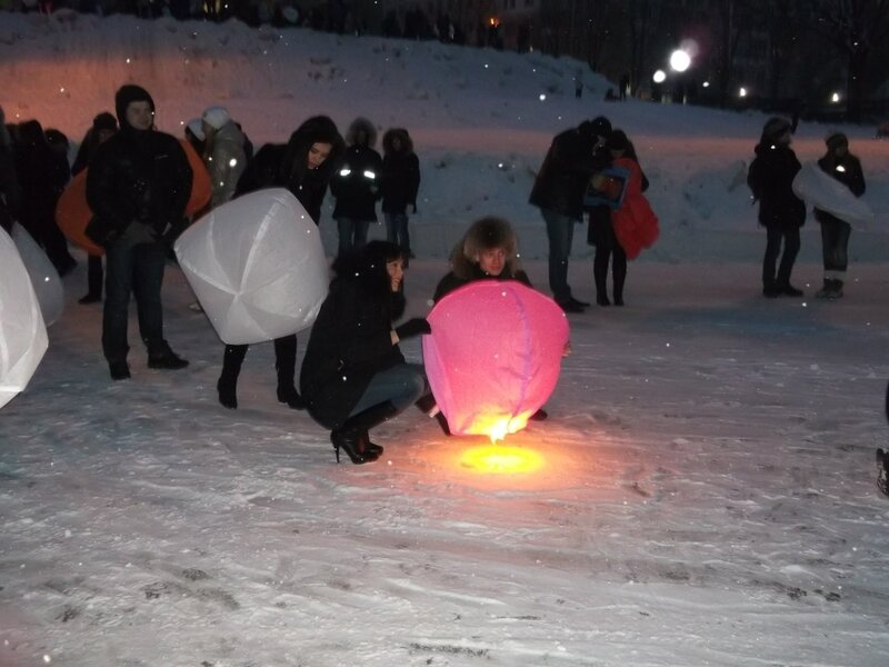 People launching sky lanterns