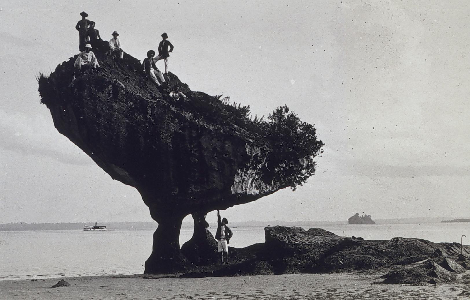 People on a balancing rock