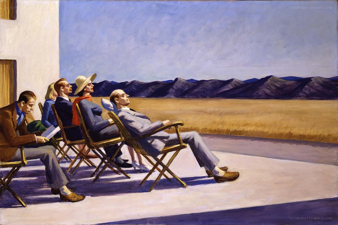 People on a balcony overlooking mountains