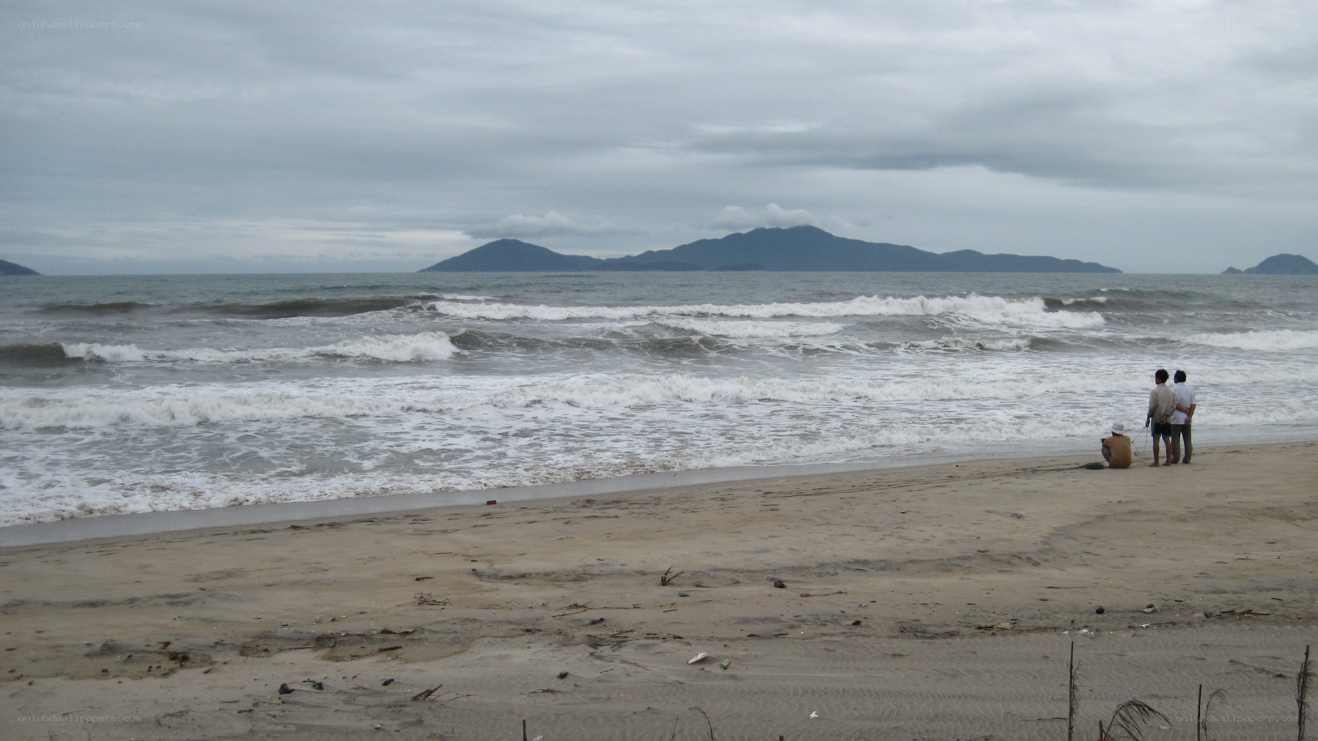 People on a beach with waves
