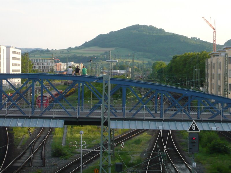 People on a blue railway bridge