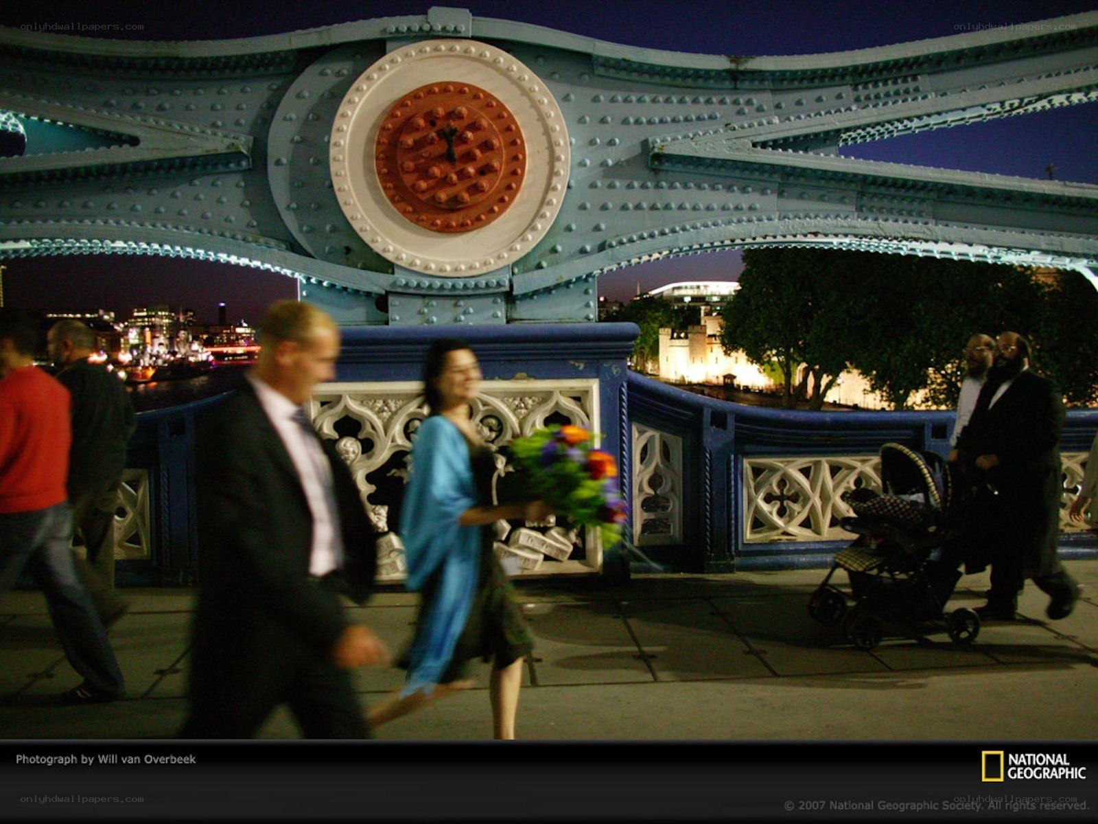 People on a bridge at night