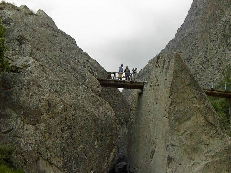 People on a bridge in a canyon