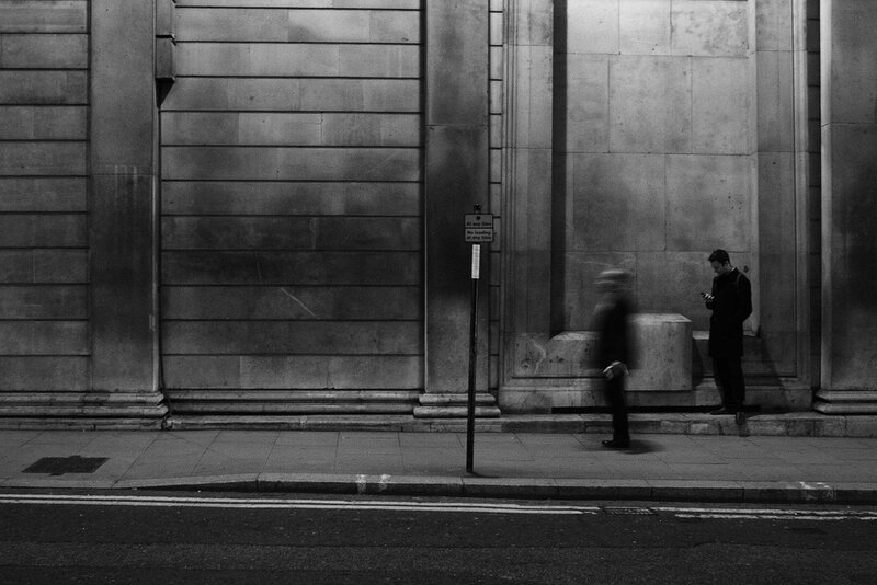 People on a city street at night