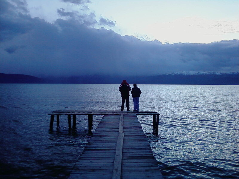 People on a dock at dusk