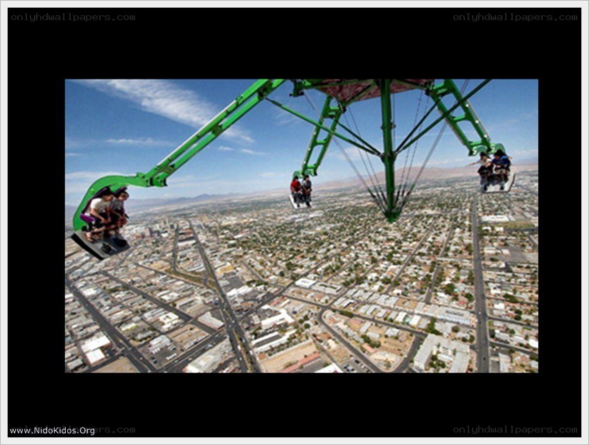 People on a high swing ride