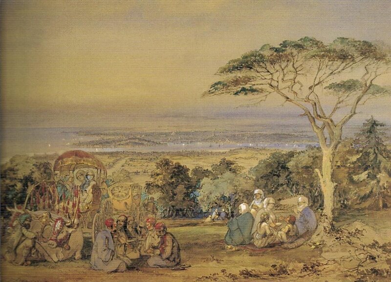 People on a hillside with city view