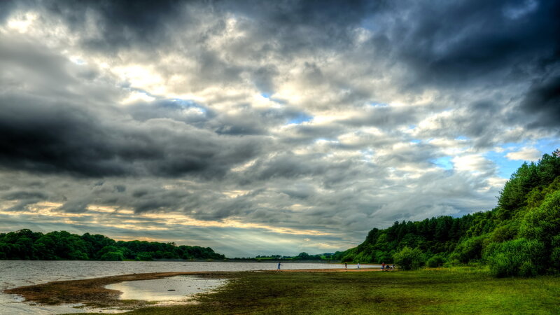 People on a Lake Shore