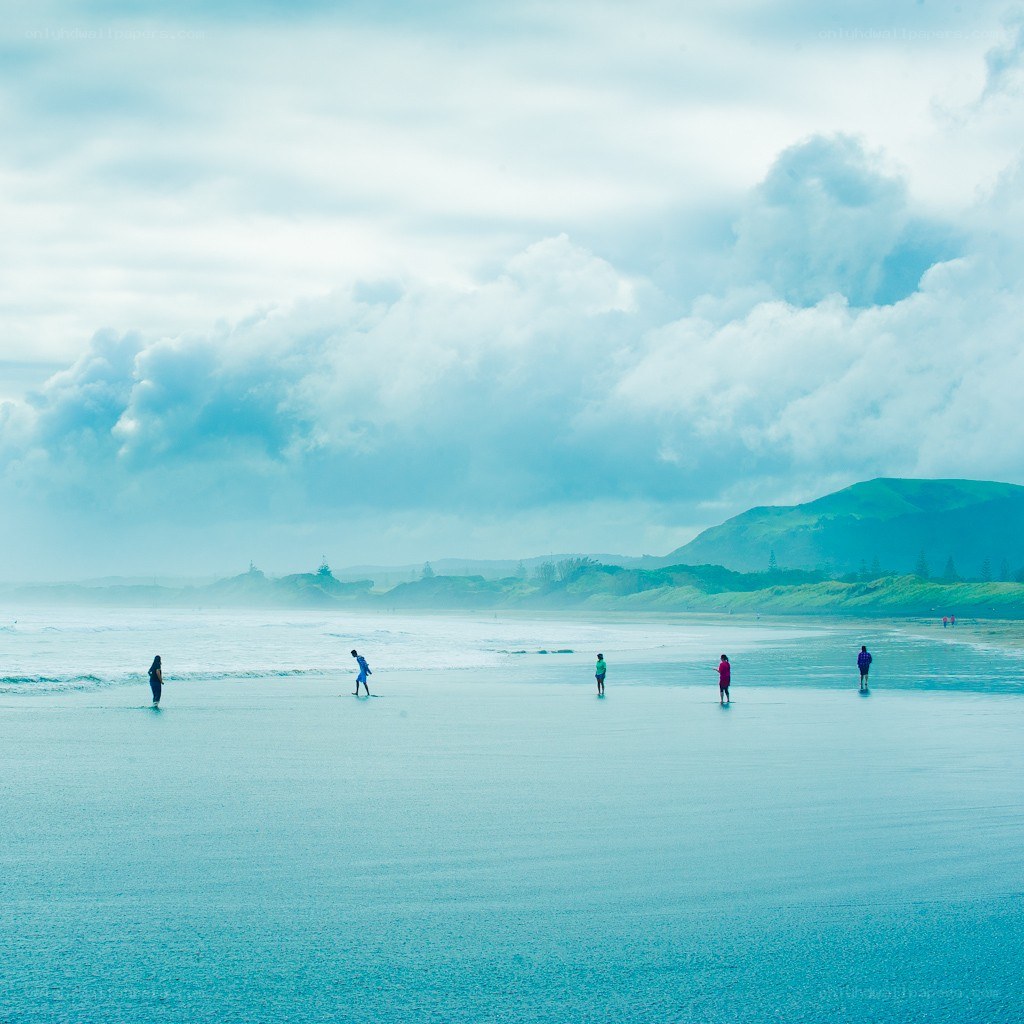 People on a misty beach