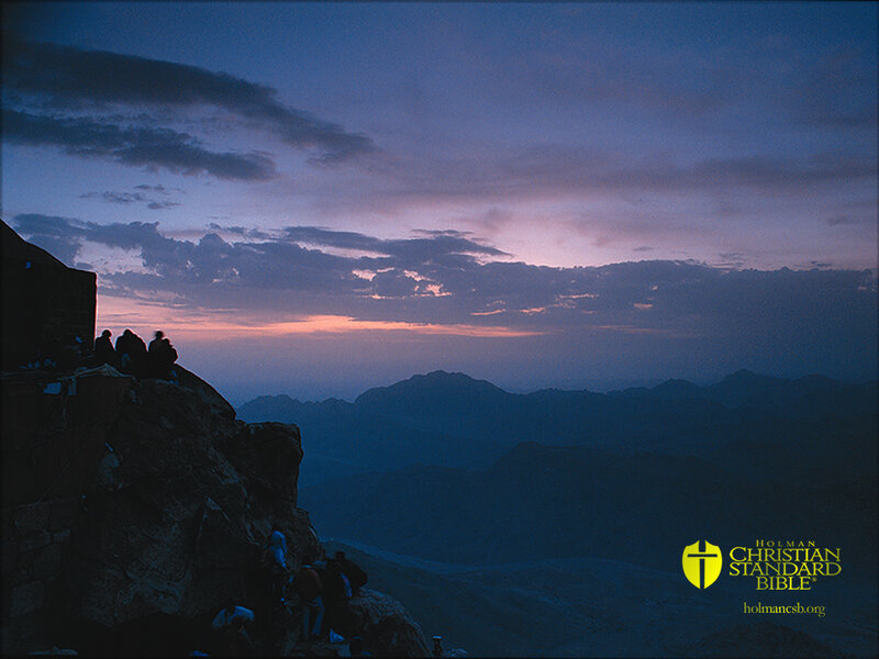 People on a mountain at dusk