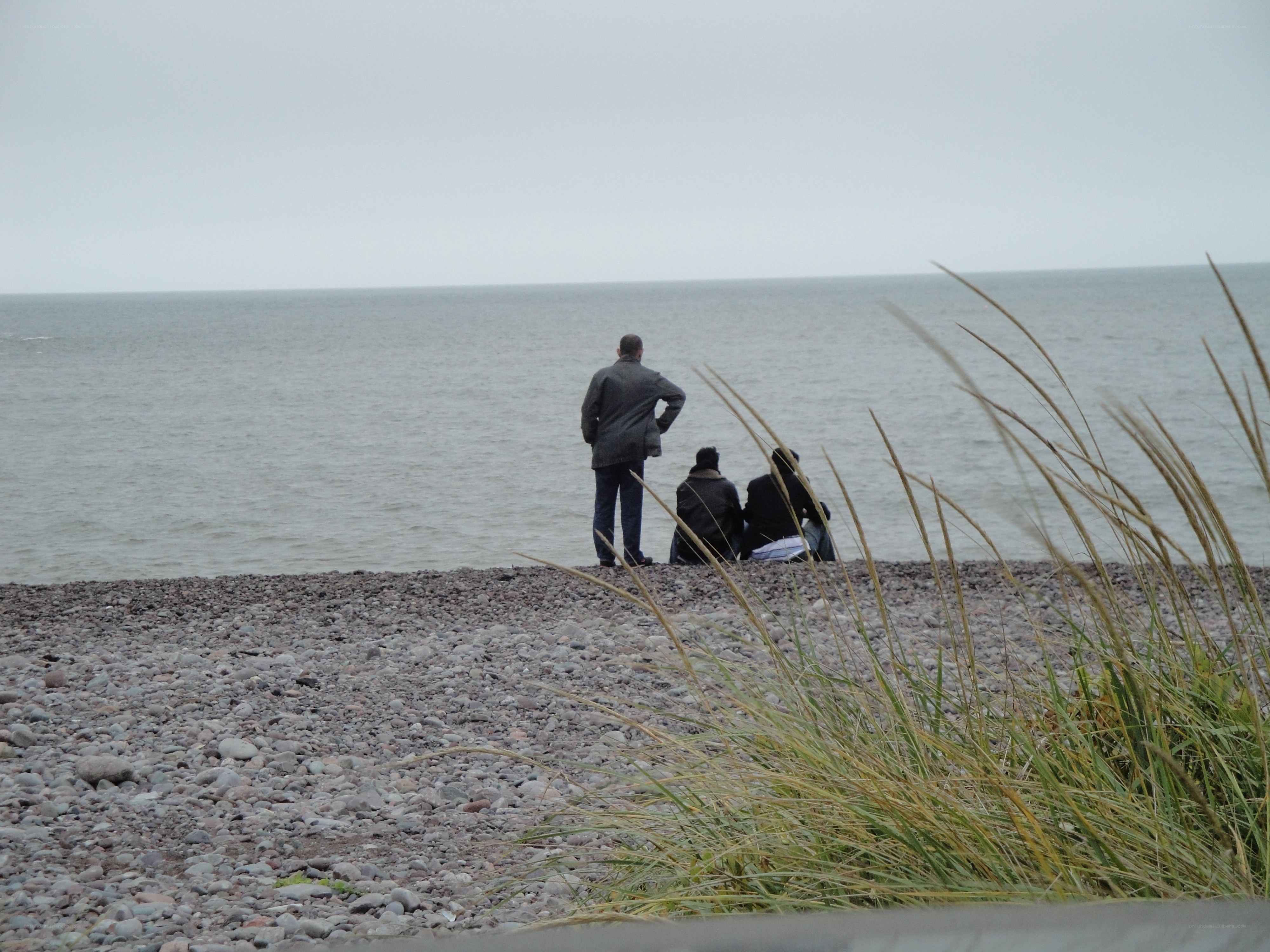 People on a pebble beach
