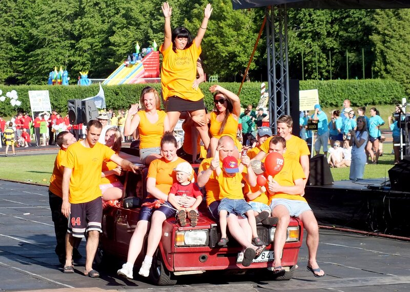 People on a Red Car