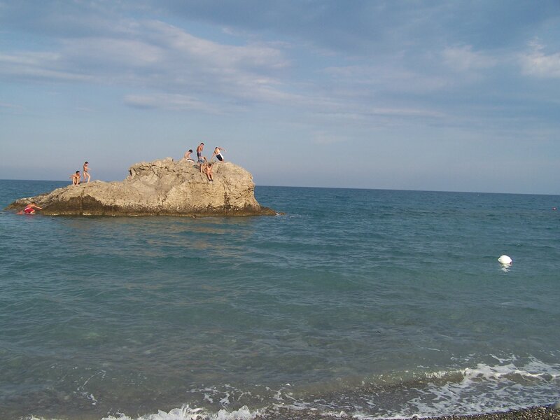 People on a rock in the sea
