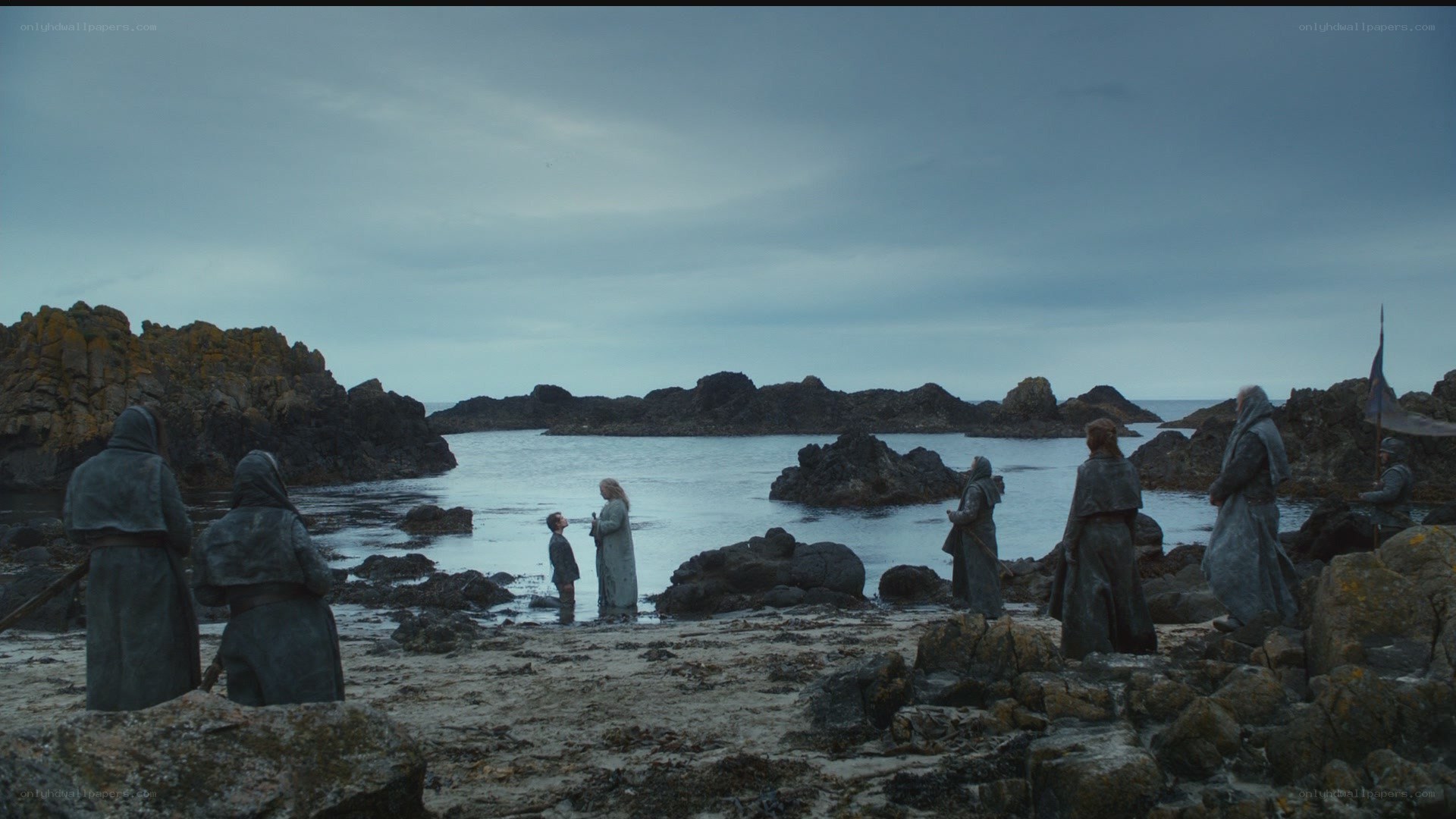 people on a rocky beach
