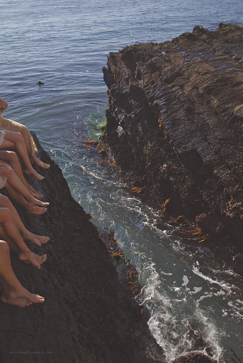 People on a rocky cliff