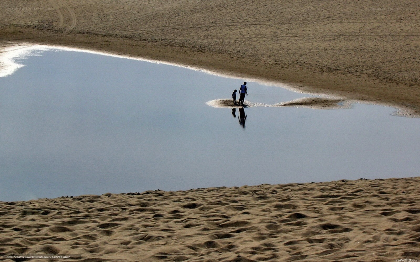 People on a sandbar in a river