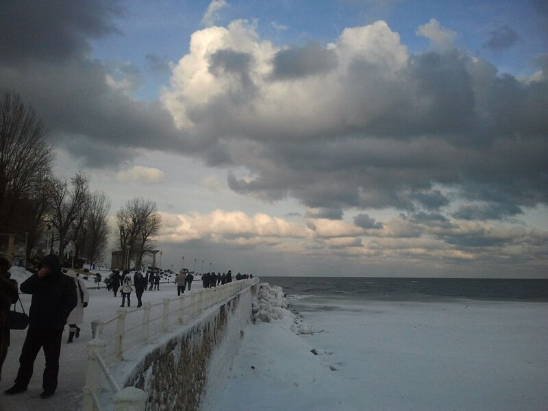 People on a Snowy Pier