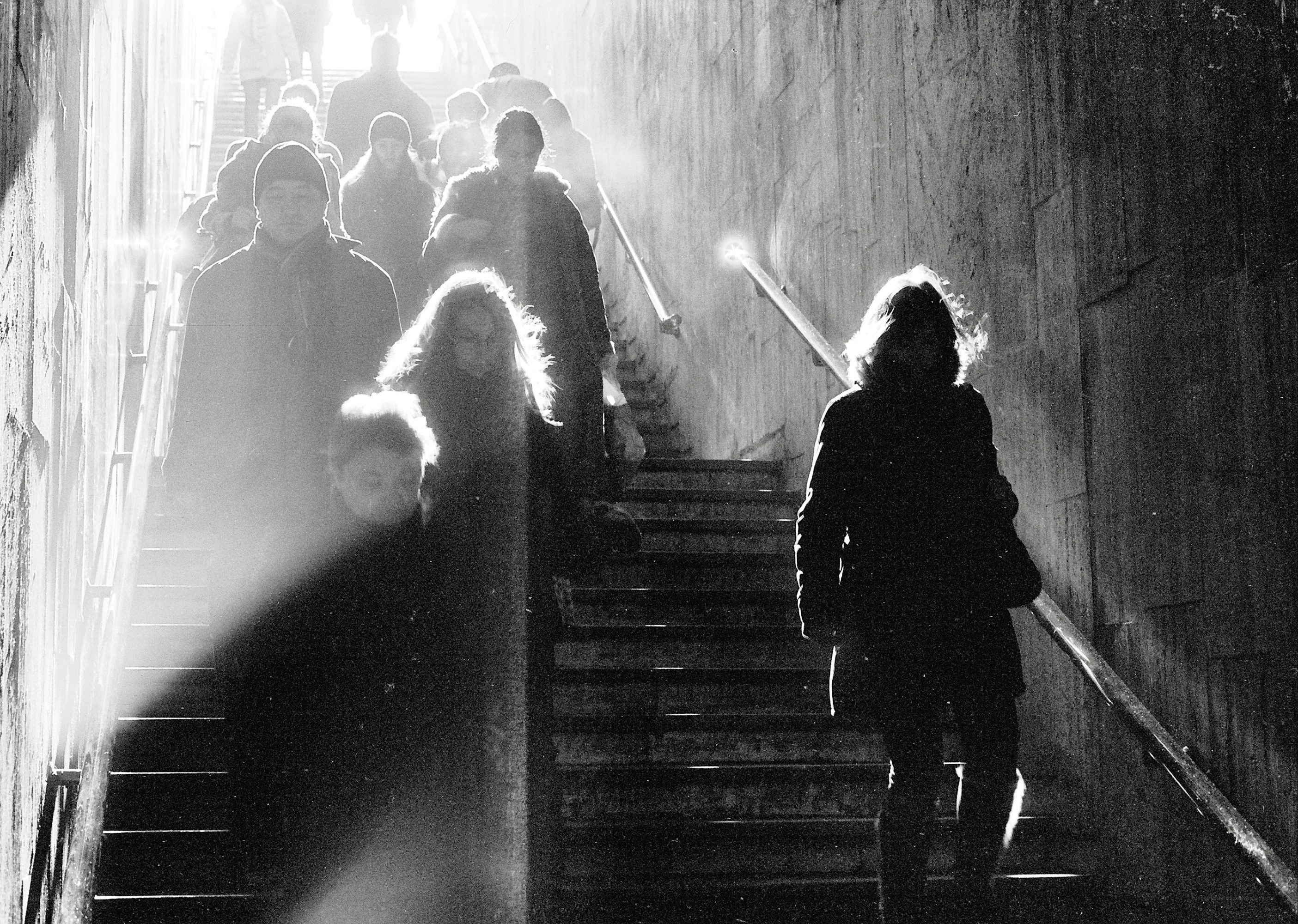 People on a Staircase in Light
