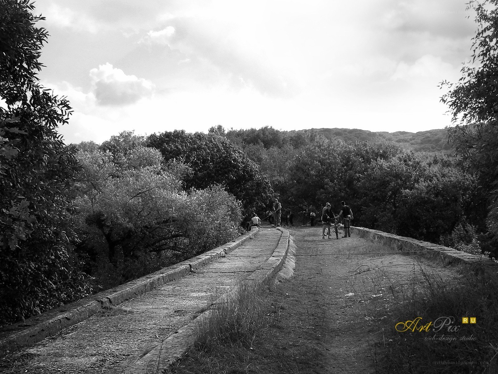 People on a stone bridge