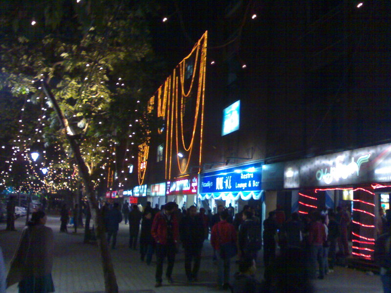 People on a Street at Night