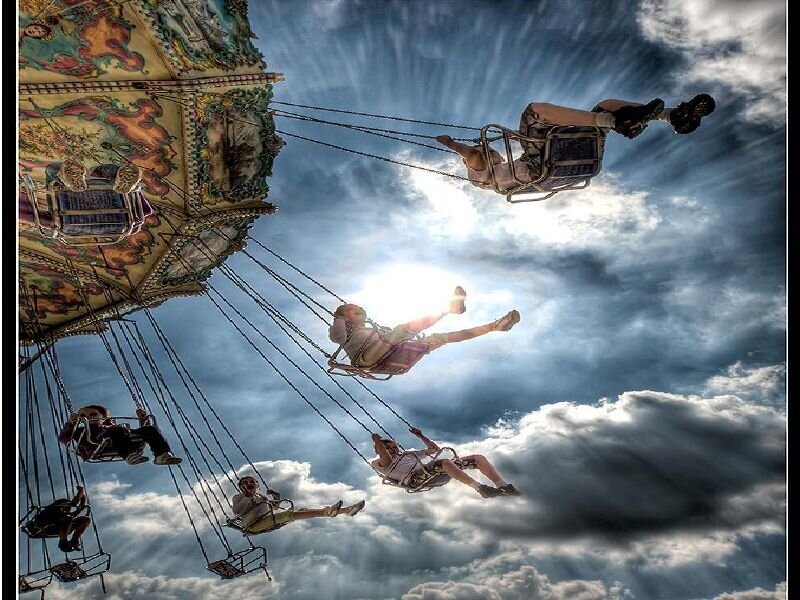 People on a swinging ride