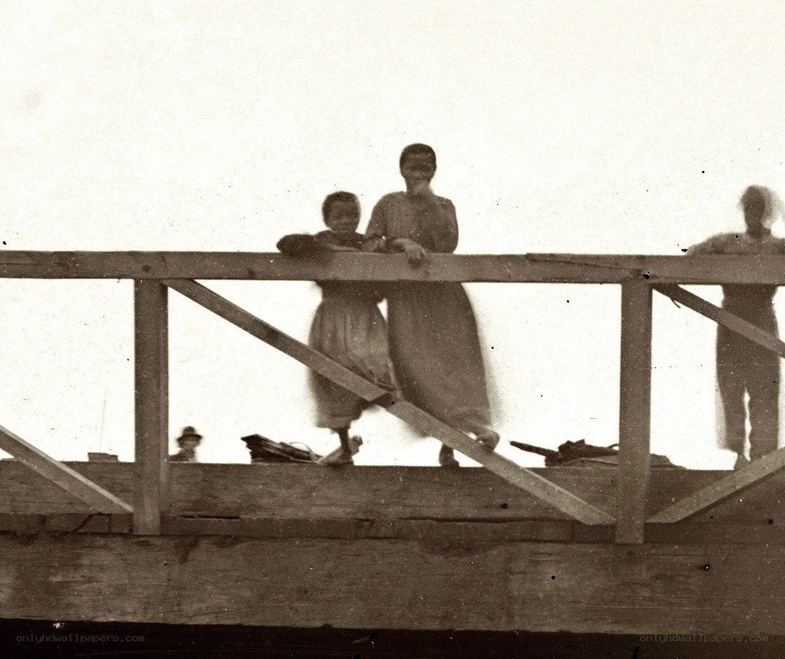 People on a wooden structure
