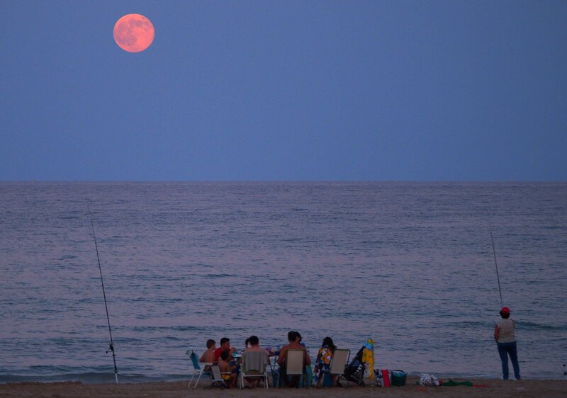 People on Beach at Dusk — Blue