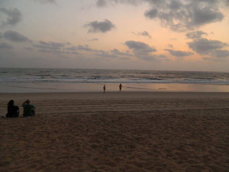 People on Beach at Sunset — Brown, Calm