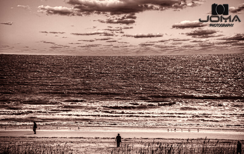 People on Beach at Sunset — Brown