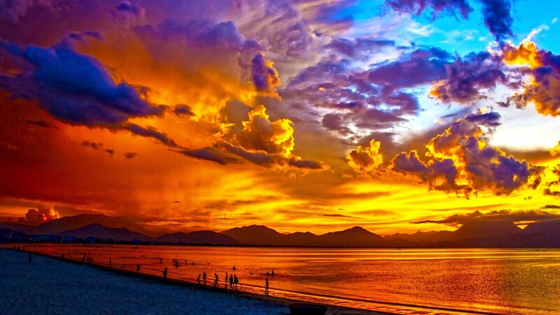 People on Beach at Sunset — Orange, Dramatic, Photograph, Mountains