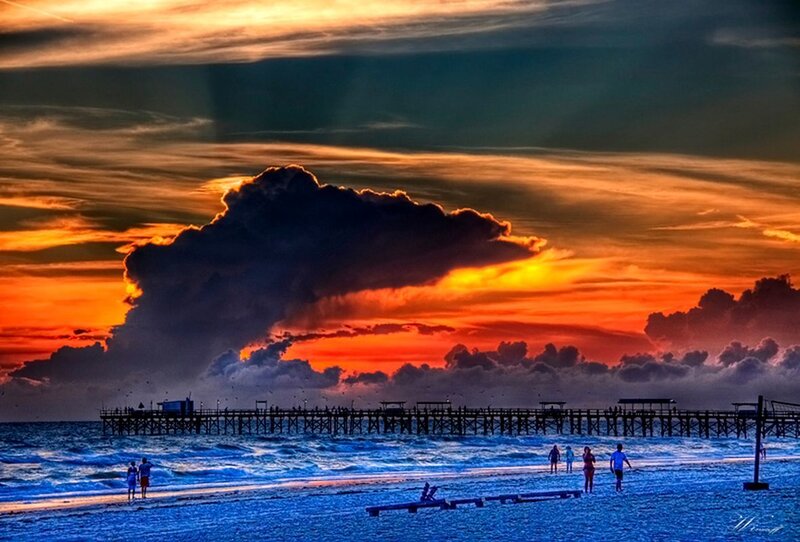 People on Beach at Sunset — Orange, Dramatic