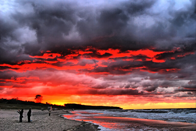 People on Beach at Sunset — Red