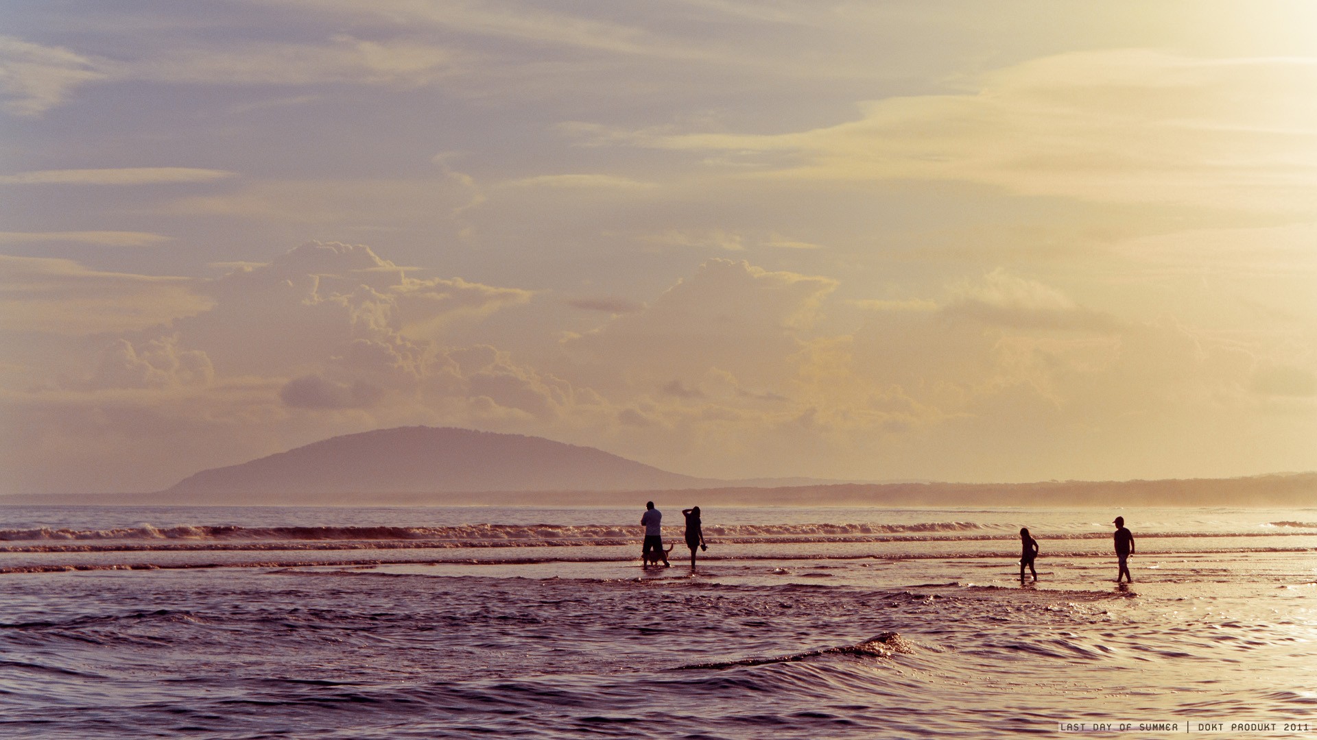 People on beach at sunset